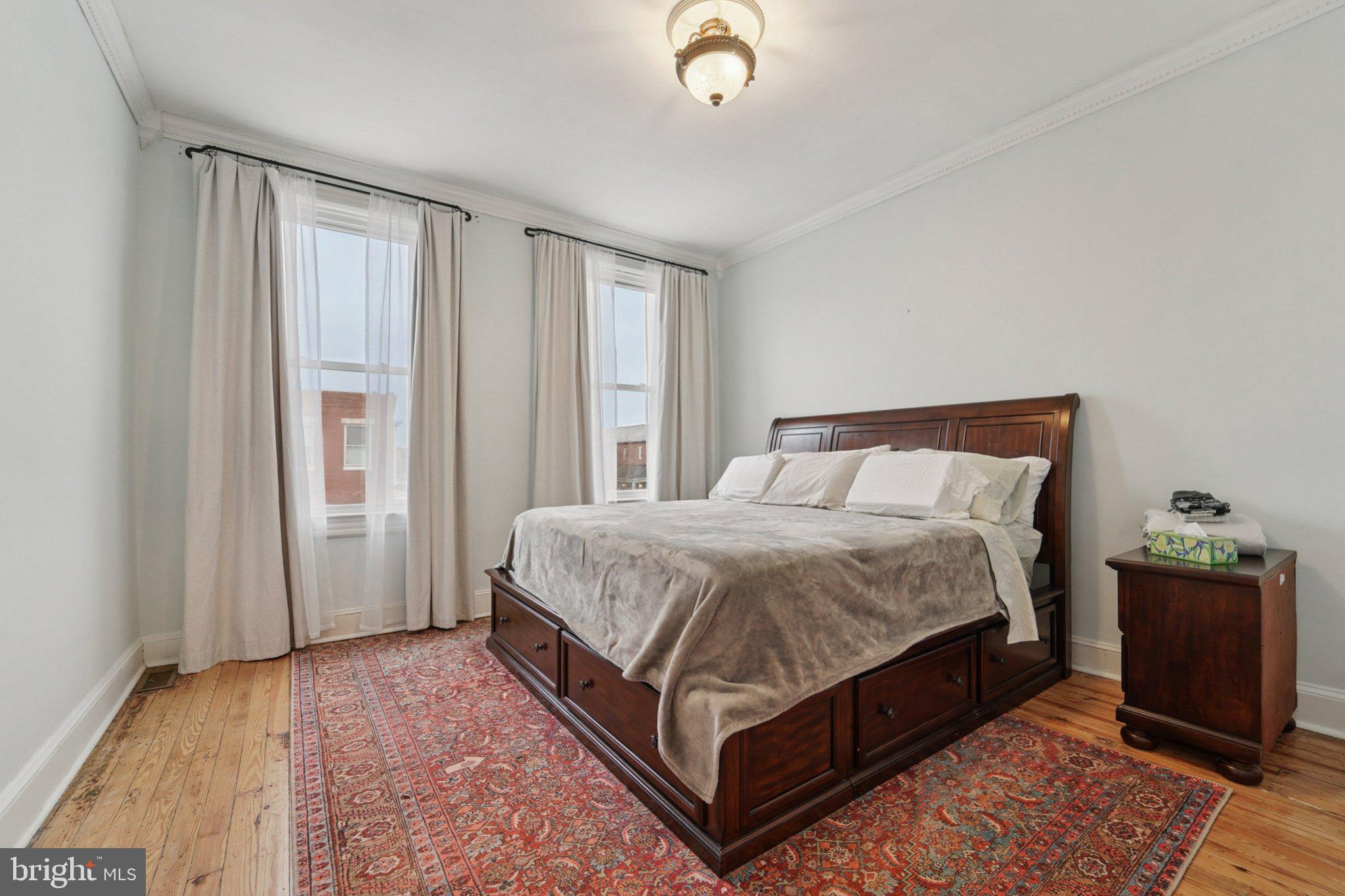 3929 Hudson Street Baltimore, MD 21224 - Photo 23 of 48 a bedroom with a bed and window