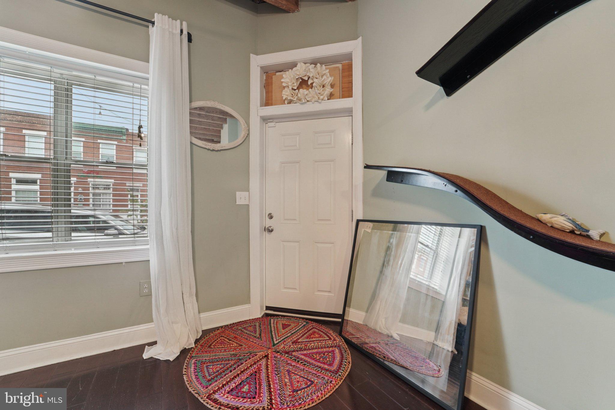 3929 Hudson Street Baltimore, MD 21224 - Photo 4 of 48 a view of an entryway with wooden floor