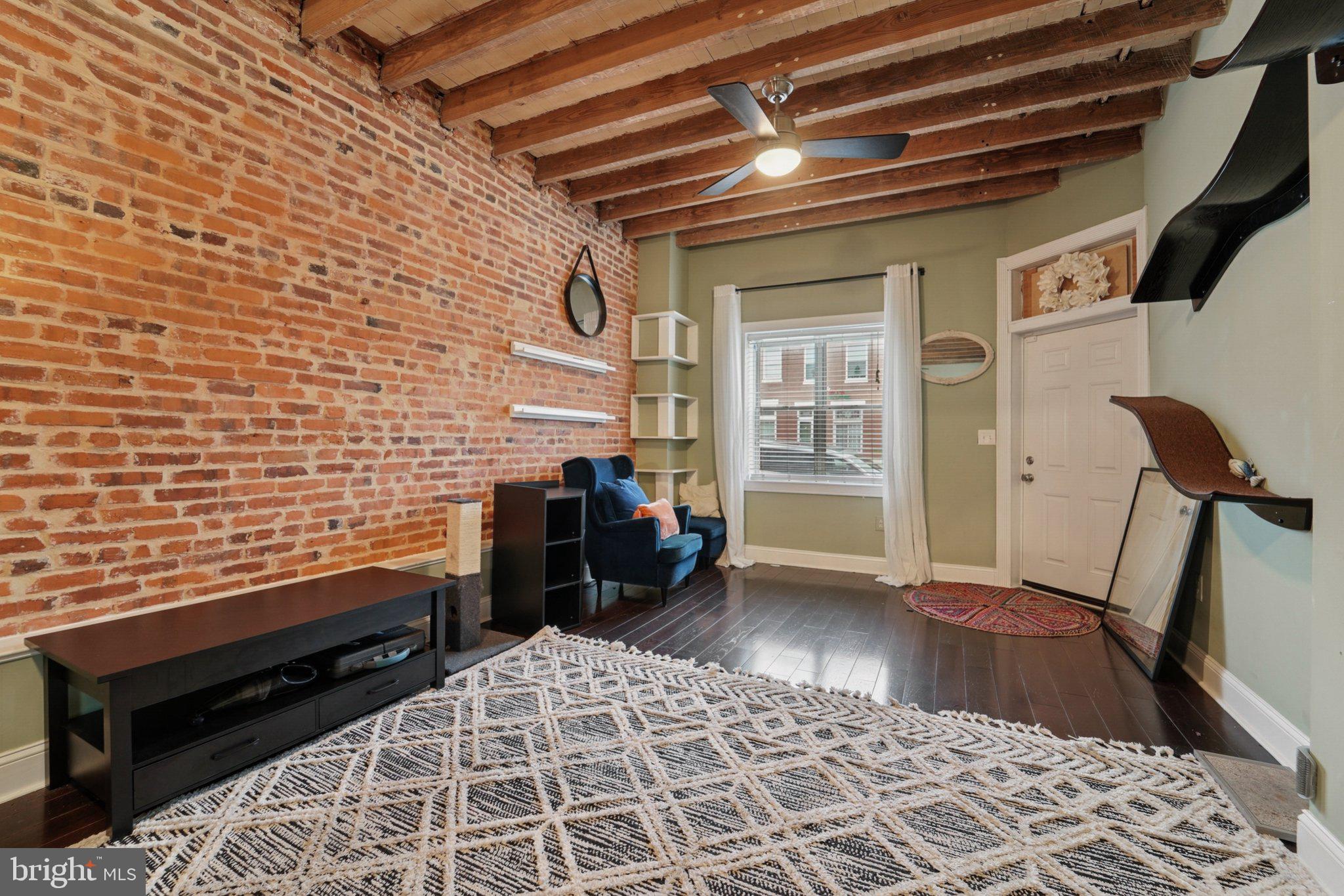 3929 Hudson Street Baltimore, MD 21224 - Photo 5 of 48 a view of a livingroom with furniture and wooden floor