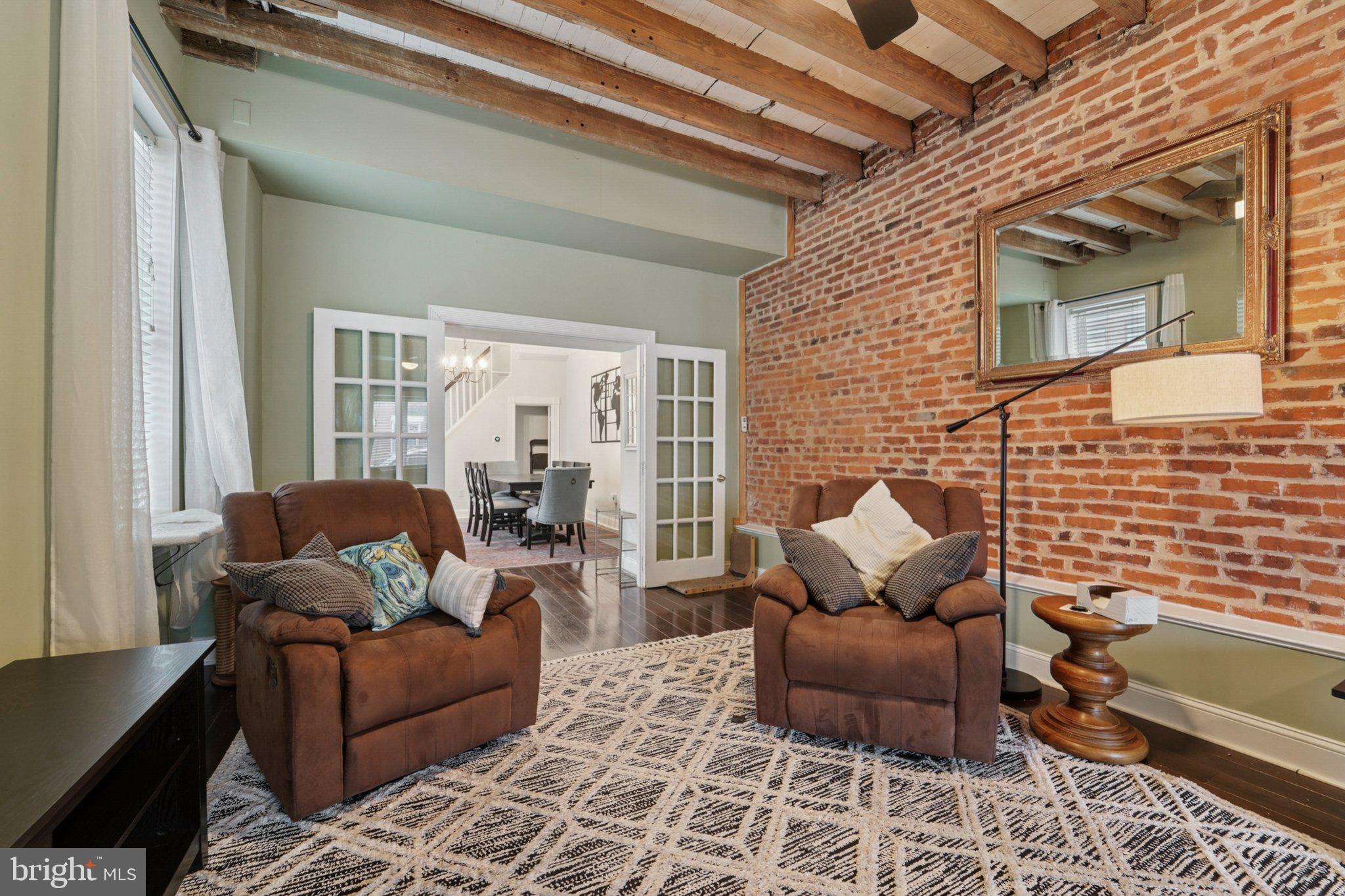 3929 Hudson Street Baltimore, MD 21224 - Photo 7 of 48 a living room with furniture and a rug
