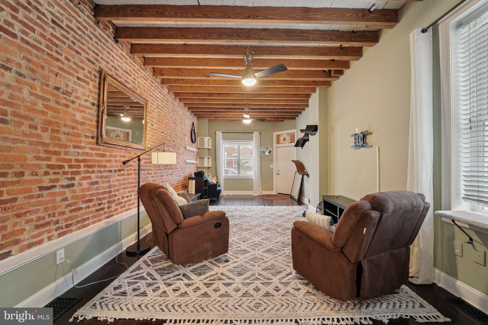 3929 Hudson Street Baltimore, MD 21224 - Photo 8 of 48 a living room with furniture and a fireplace
