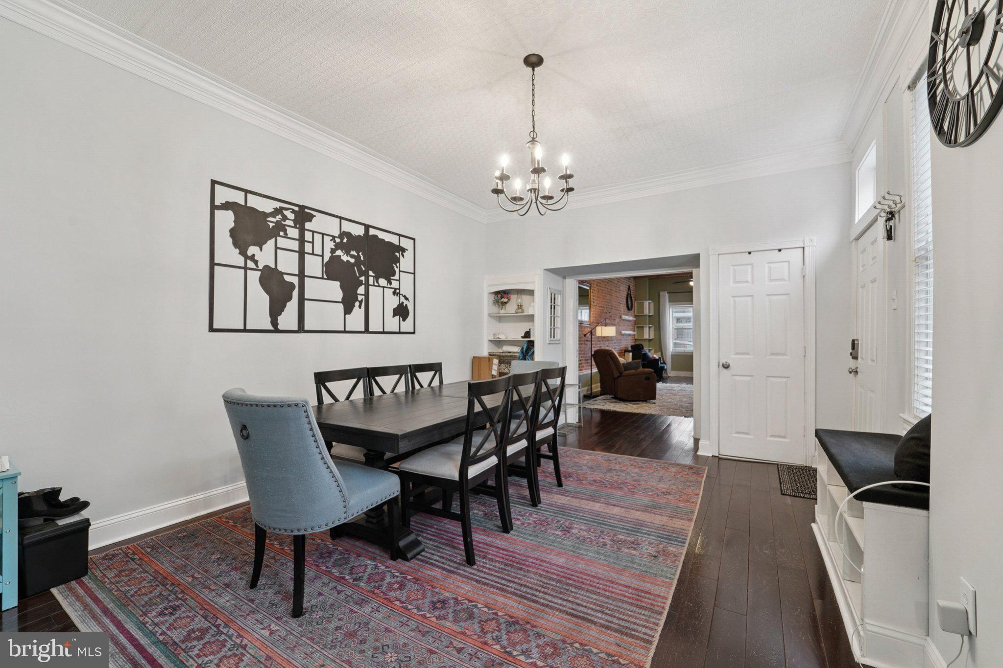 3929 Hudson Street Baltimore, MD 21224 - Photo 10 of 48 a view of a dining room with furniture window and wooden floor