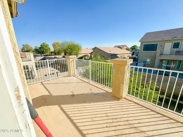 an aerial view of a house with a patio