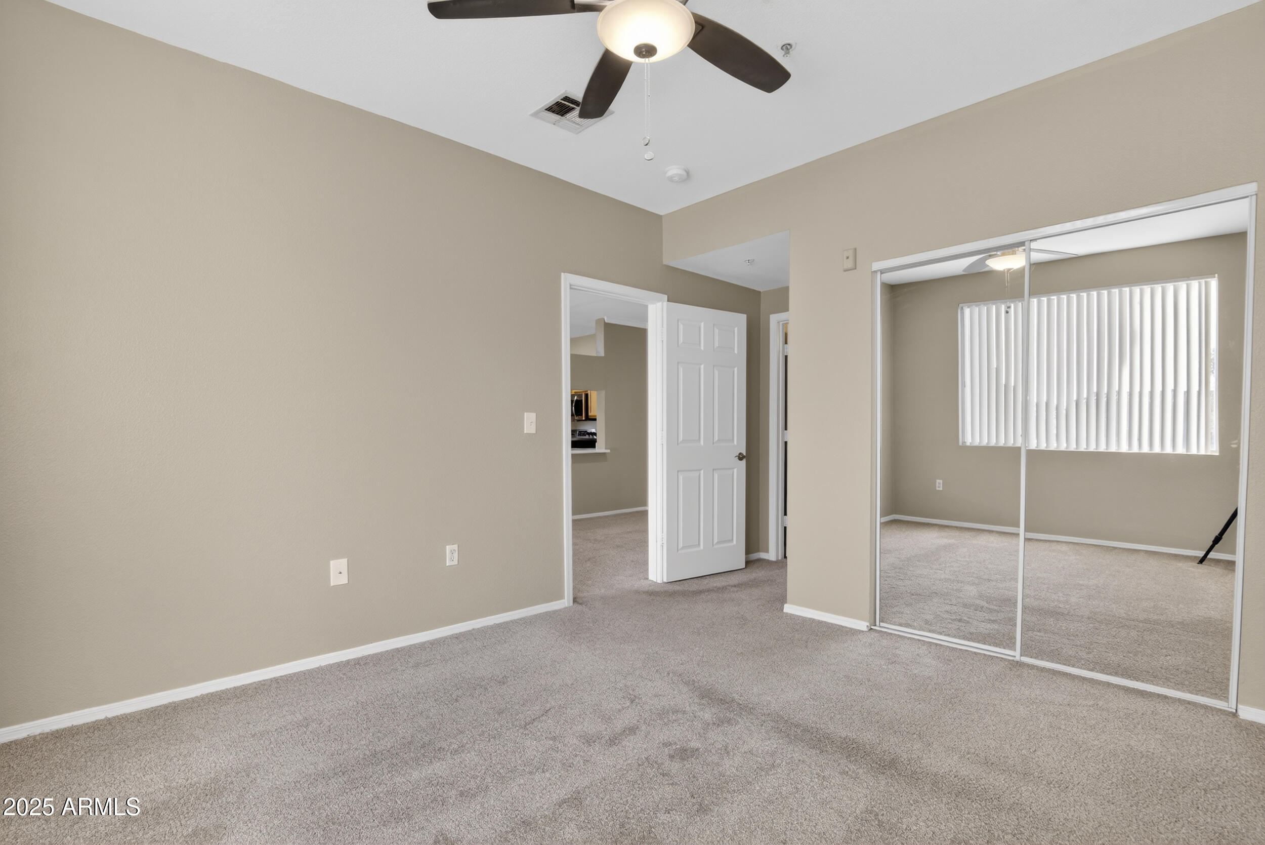 5401 East Van Buren Street, Unit 2022 Phoenix, AZ 85008 - Photo 14 of 37 a view of an empty room with a ceiling fan