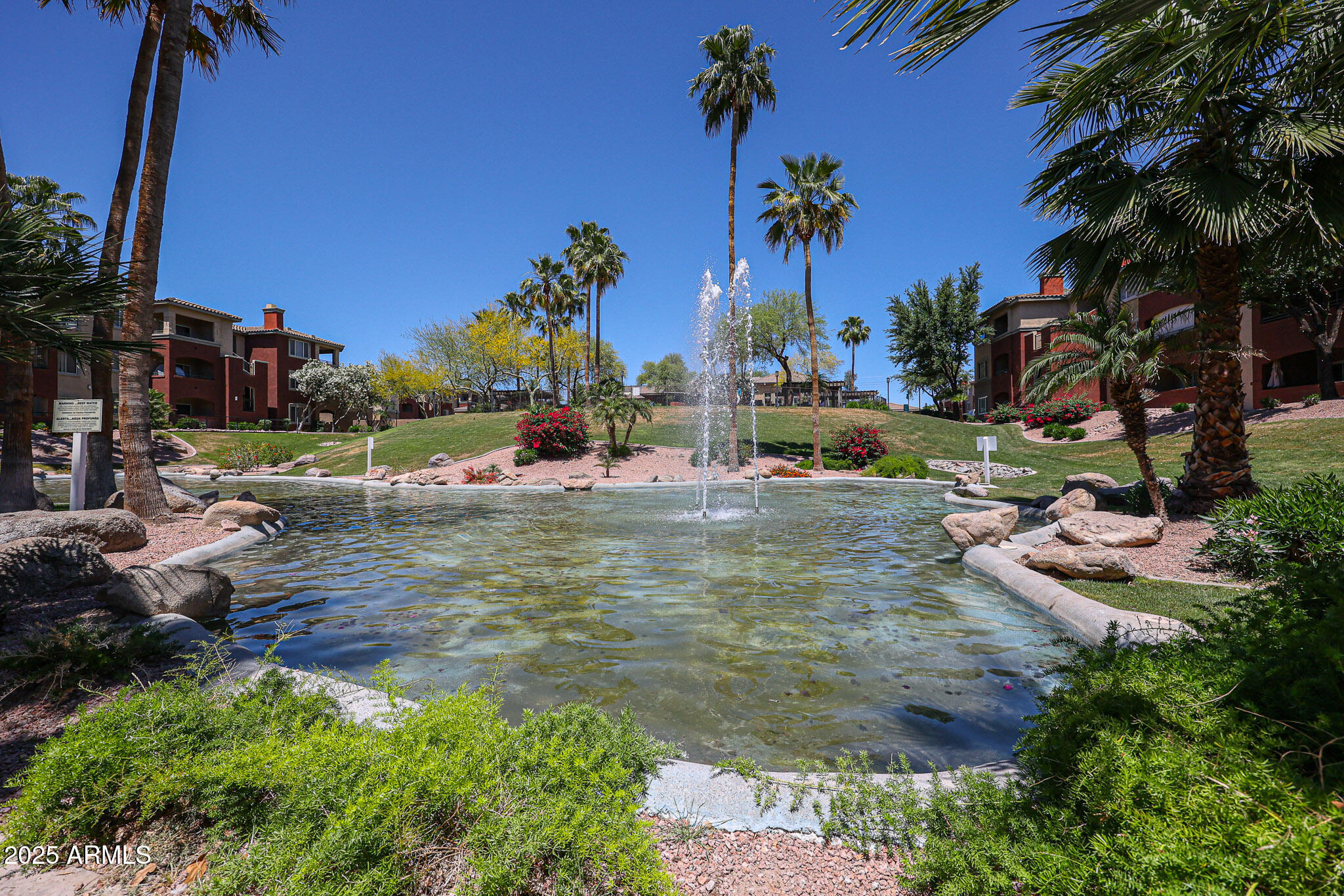 5401 East Van Buren Street, Unit 2022 Phoenix, AZ 85008 - Photo 30 of 37 a view of swimming pool with a table and chairs