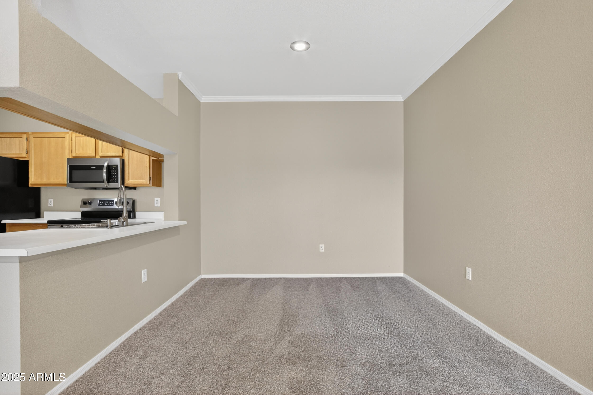 5401 East Van Buren Street, Unit 2022 Phoenix, AZ 85008 - Photo 8 of 37 a kitchen with a refrigerator and a stove top oven