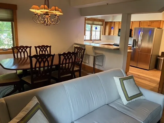 a view of kitchen and dining room with windows