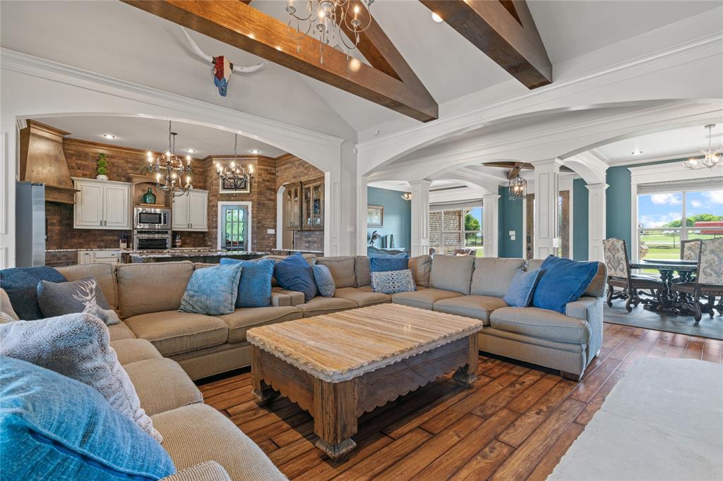 12190 Marion Road Sanger, TX 76266 - Photo 13 of 39 a living room with furniture ceiling fan and a rug