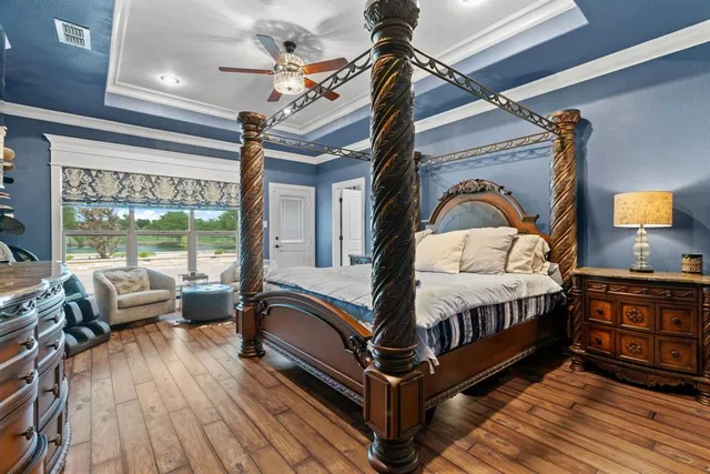 a view of living room with furniture and wooden floor
