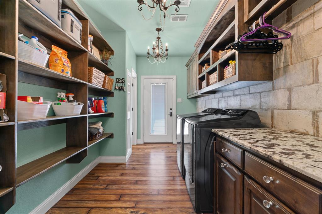 12190 Marion Road Sanger, TX 76266 - Photo 20 of 39 a kitchen with stainless steel appliances granite countertop a stove and cabinets