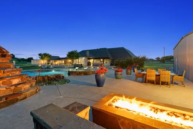 a view of a swimming pool with a patio