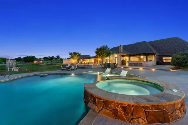 a swimming pool with outdoor seating