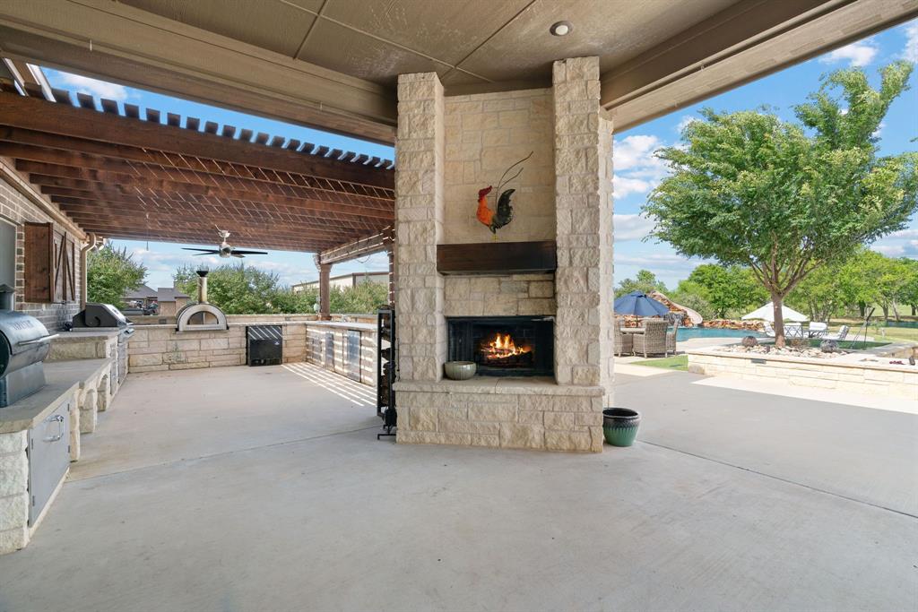 12190 Marion Road Sanger, TX 76266 - Photo 37 of 39 a view of a patio with table and chairs and potted plants