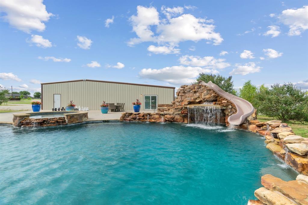 12190 Marion Road Sanger, TX 76266 - Photo 38 of 39 a view of a house with backyard and sitting area