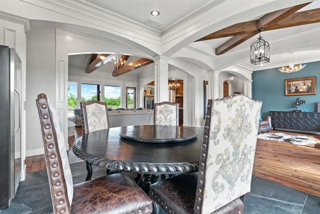 a dining room with furniture and wooden floor