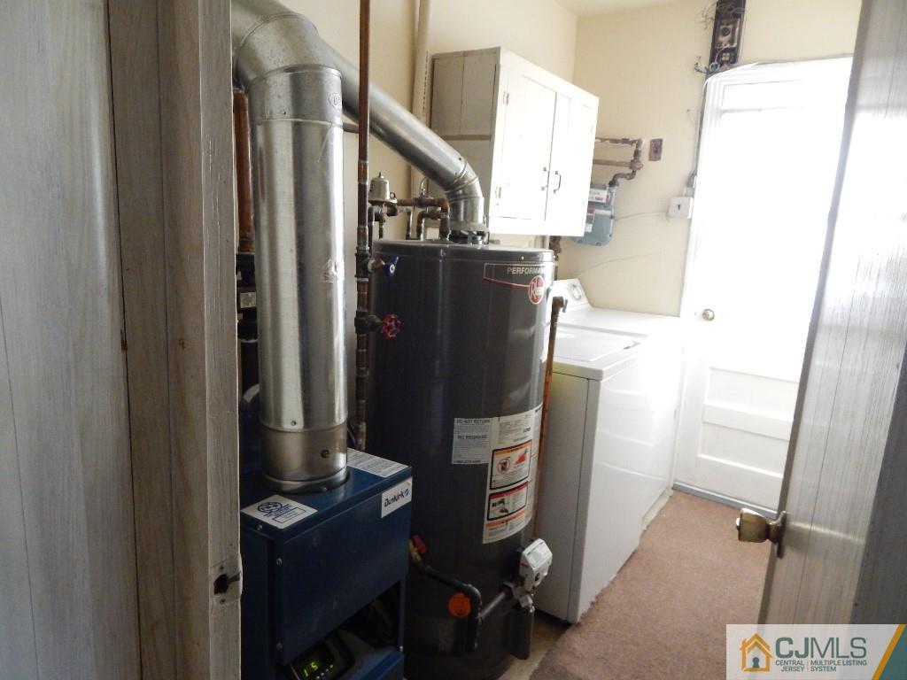 11 Dobson Road Edison, NJ 08817 - Photo 13 of 16 a view of a storage & utility room with washer and dryer