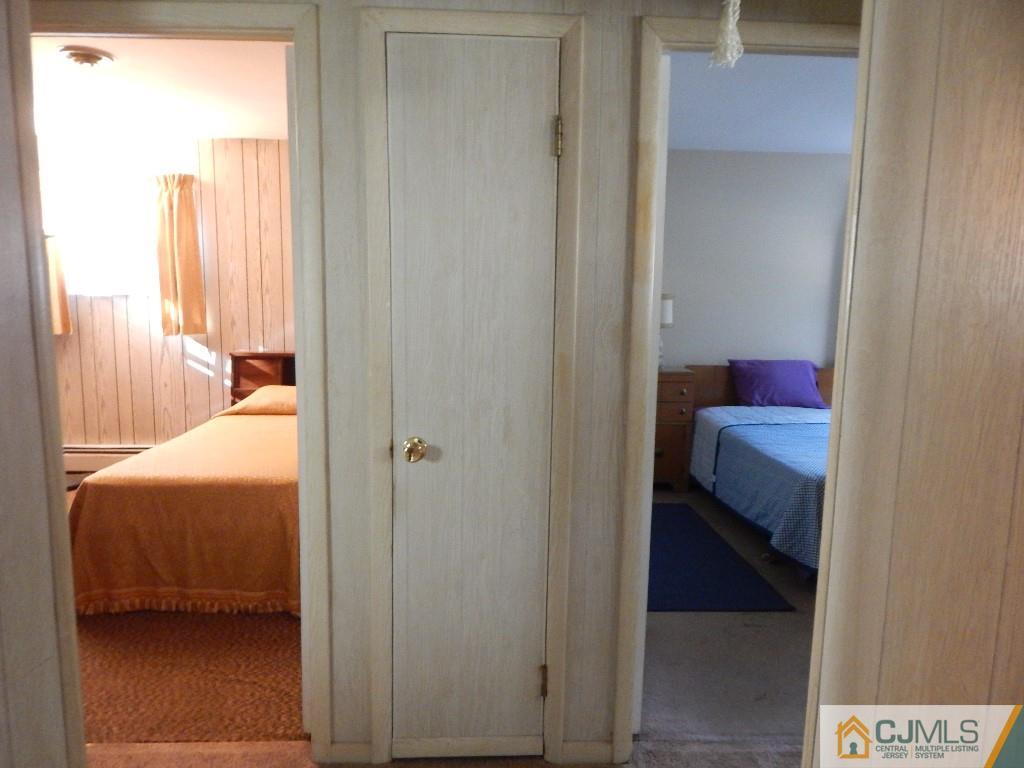 11 Dobson Road Edison, NJ 08817 - Photo 15 of 16 a room that has a bed and a chair
