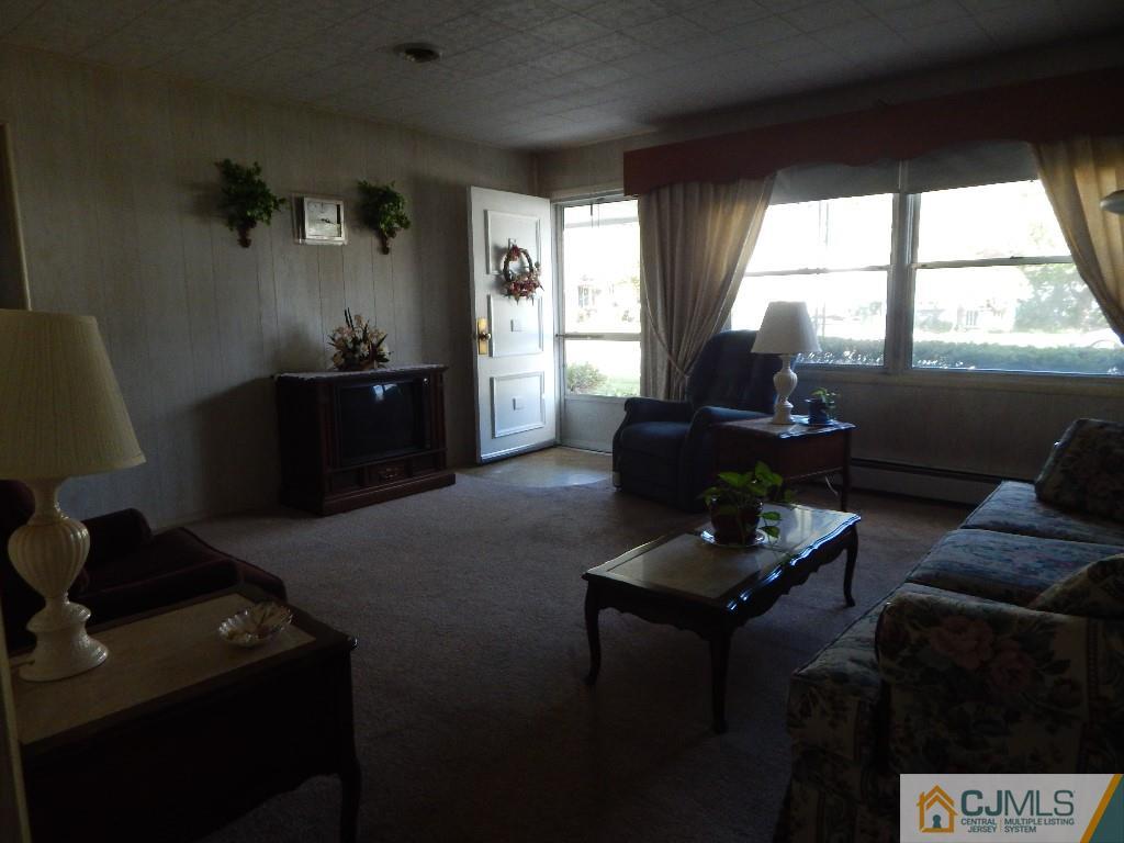 11 Dobson Road Edison, NJ 08817 - Photo 3 of 16 a living room with furniture and a window