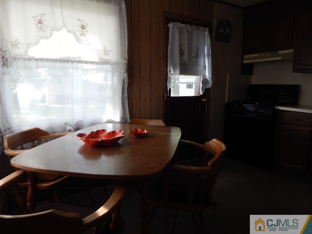 11 Dobson Road Edison, NJ 08817 - Photo 5 of 16 a view of a dining room with furniture and window