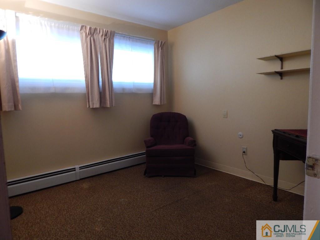 11 Dobson Road Edison, NJ 08817 - Photo 8 of 16 a room with a window and a wooden floor