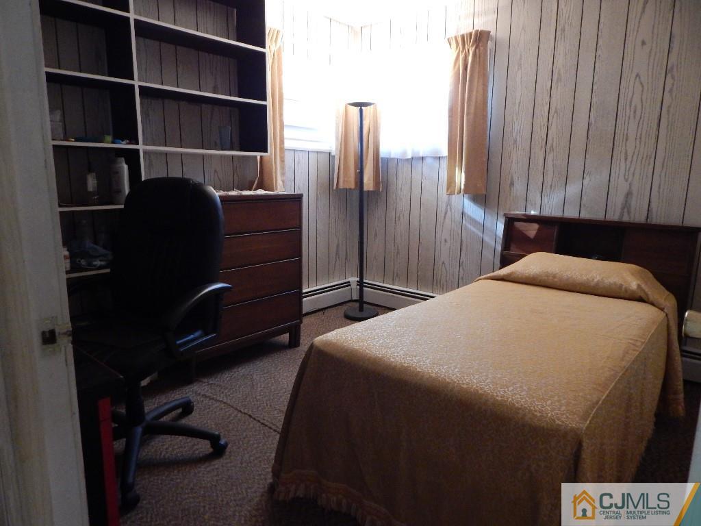 11 Dobson Road Edison, NJ 08817 - Photo 10 of 16 a bedroom with a bed and a window