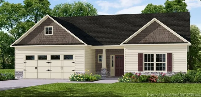 a view of a house with yard and plants