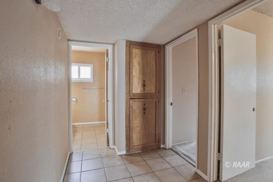1144 West St George Avenue Ridgecrest, CA 93555 - Photo 12 of 18 a view of an empty room with bathroom and a window