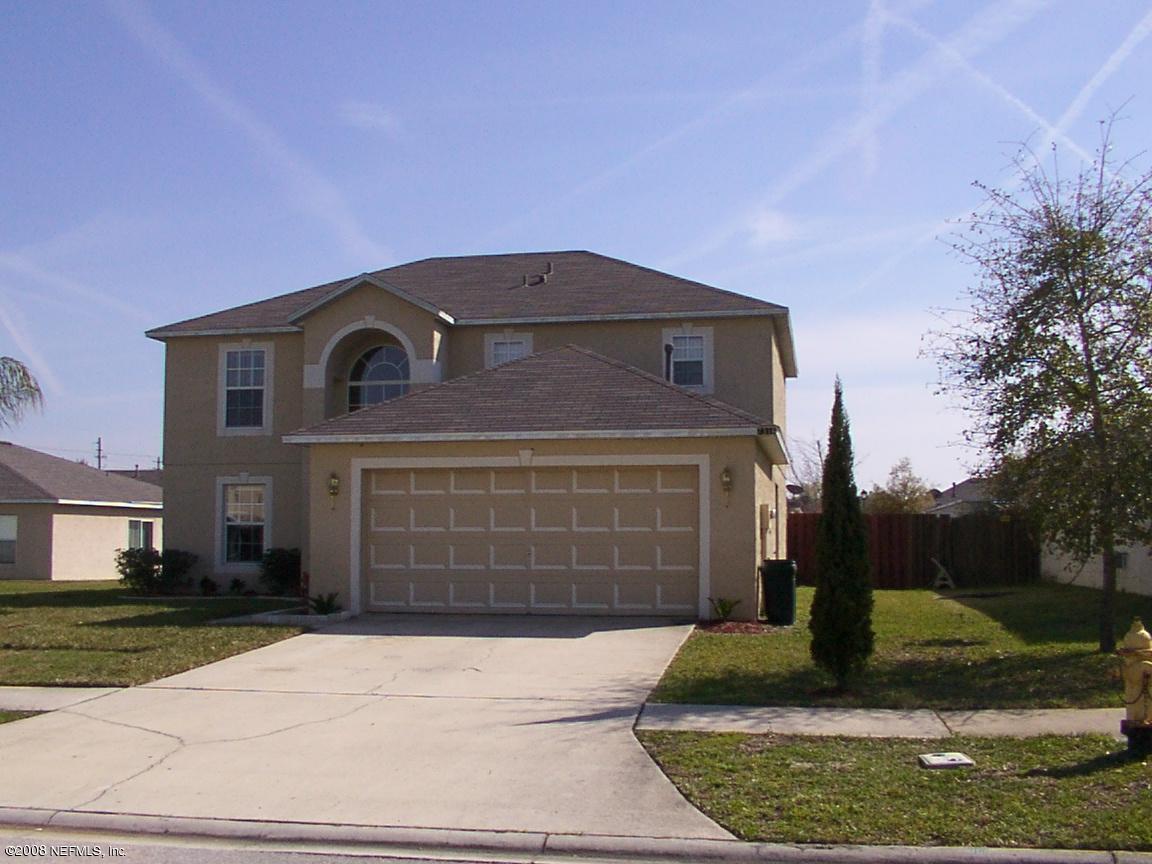 7316 Spring Hill Road Jacksonville, FL 32244 - Photo 1 of 11 a front view of a house with a yard
