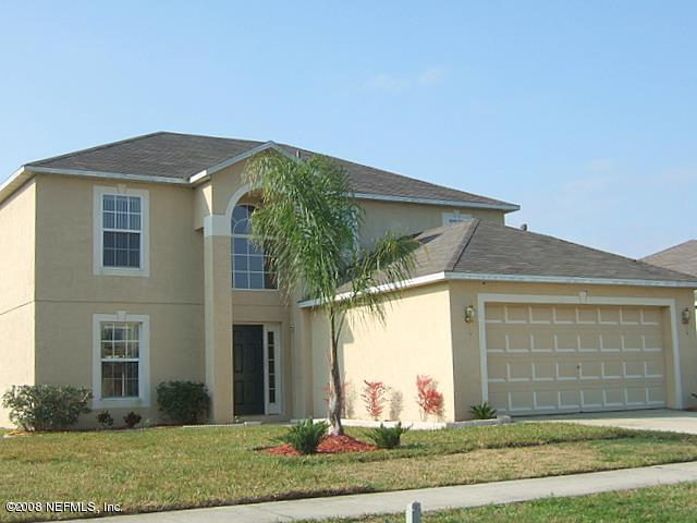 7316 Spring Hill Road Jacksonville, FL 32244 - Photo 2 of 11 a front view of a house with garden