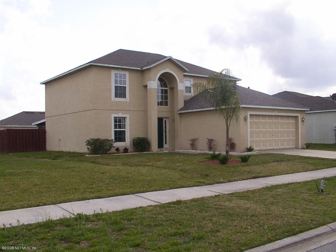 7316 Spring Hill Road Jacksonville, FL 32244 - Photo 3 of 11 a front view of a house with a yard