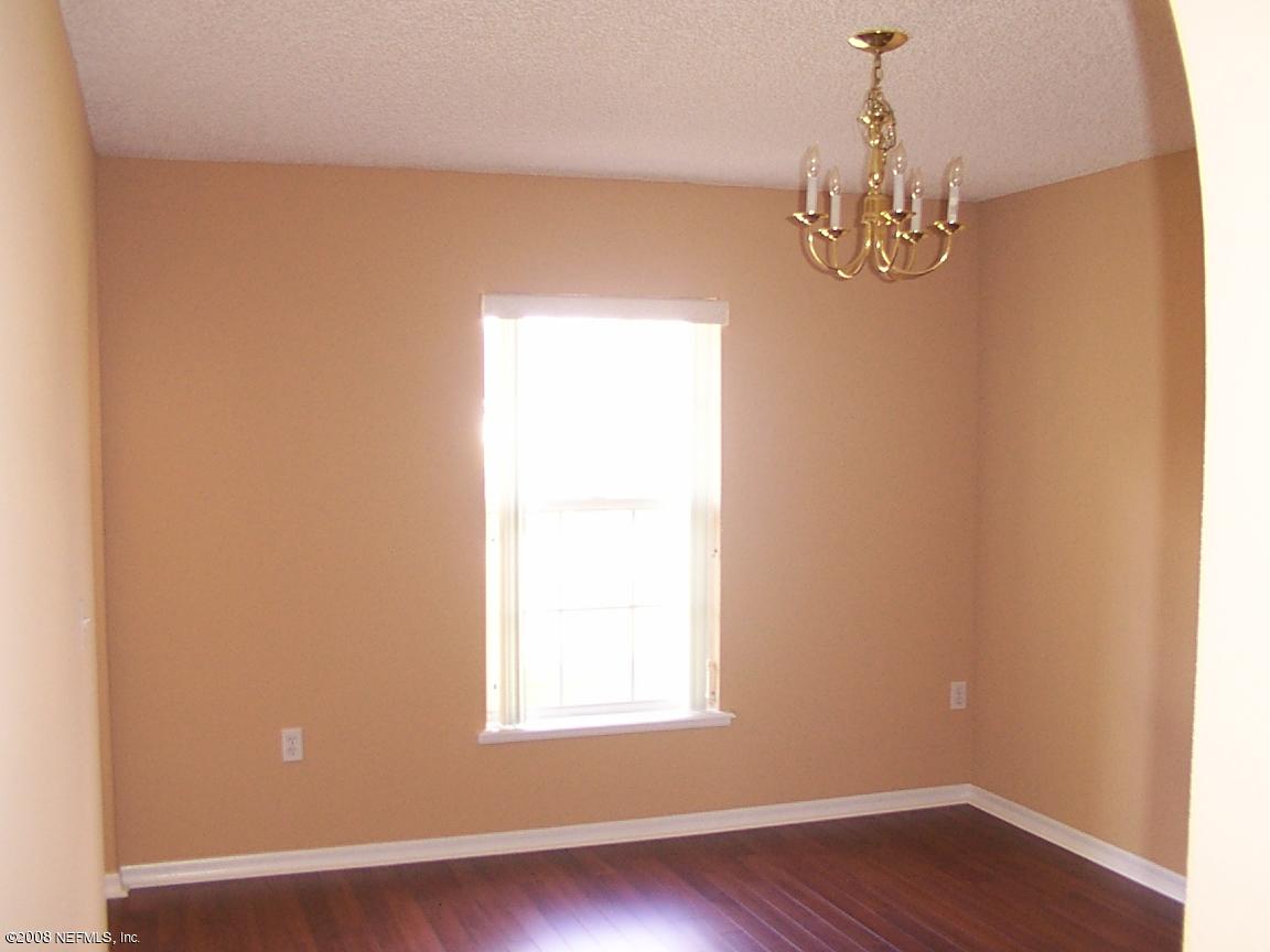 7316 Spring Hill Road Jacksonville, FL 32244 - Photo 8 of 11 wooden floor in a room next to a window