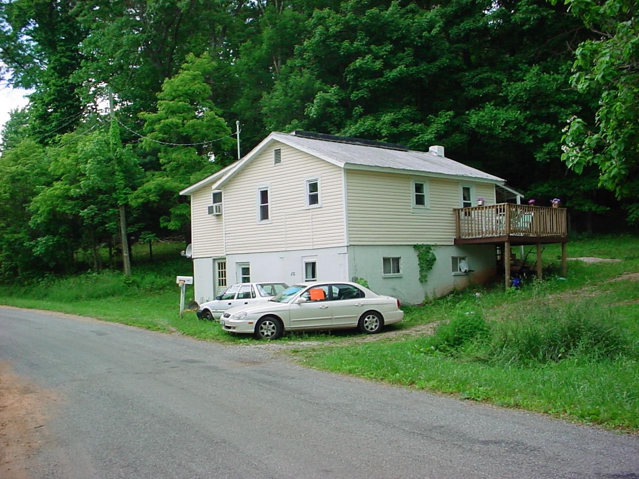 632 Harris Hollow Road Southwest Floyd, VA 24091 - Photo 1 of 2 a front view of a house with garden
