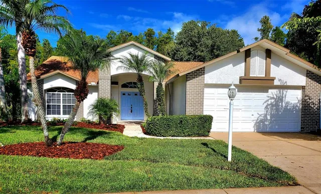 a view of a house with a yard