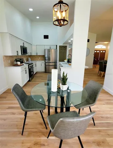 a living room with stainless steel appliances kitchen island granite countertop furniture and a kitchen view