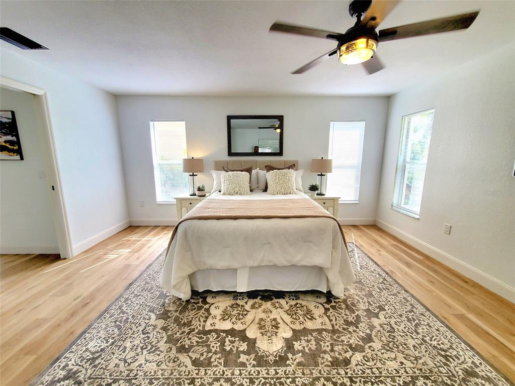 1517 Morning Rose Place Trinity, FL 34655 - Photo 24 of 50 a bedroom with a bed and a window