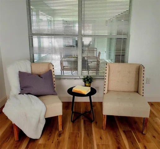 a living room with furniture and a window