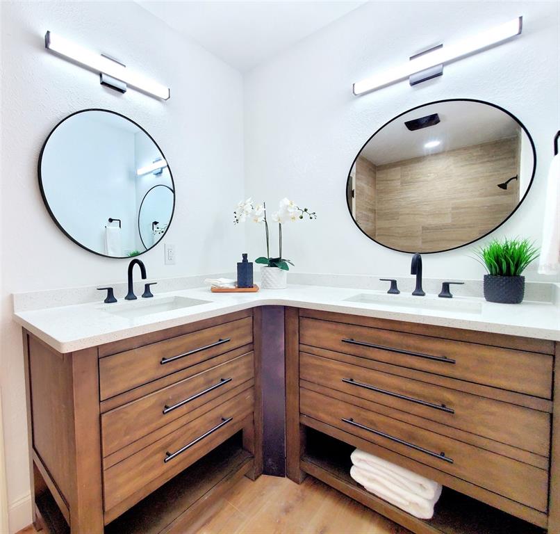 1517 Morning Rose Place Trinity, FL 34655 - Photo 29 of 50 a bathroom with a double vanity sink and a mirror