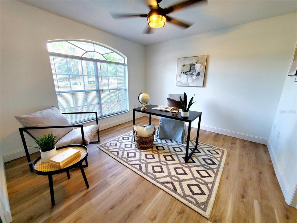 1517 Morning Rose Place Trinity, FL 34655 - Photo 34 of 50 a workspace with furniture and wooden floor