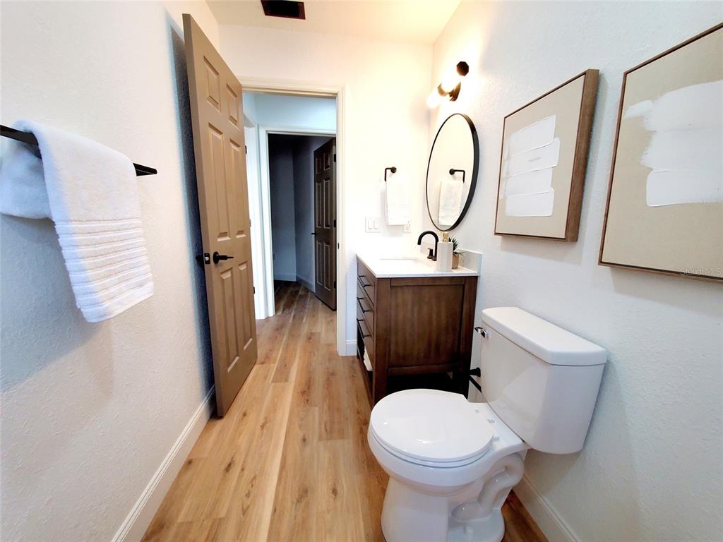 1517 Morning Rose Place Trinity, FL 34655 - Photo 37 of 50 a bathroom with a toilet sink and mirror