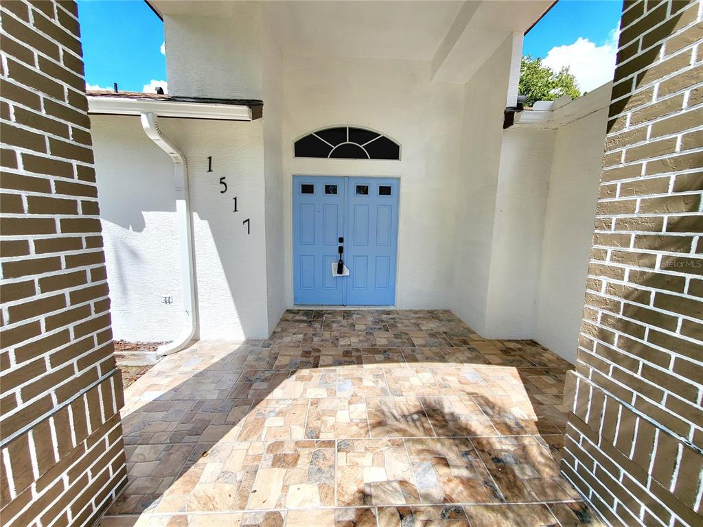 1517 Morning Rose Place Trinity, FL 34655 - Photo 4 of 50 a bedroom with a bed and a window