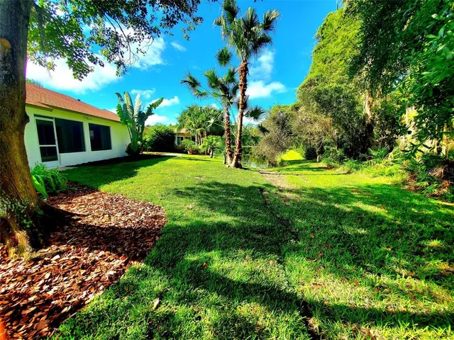 a view of a chairs and table in the patio