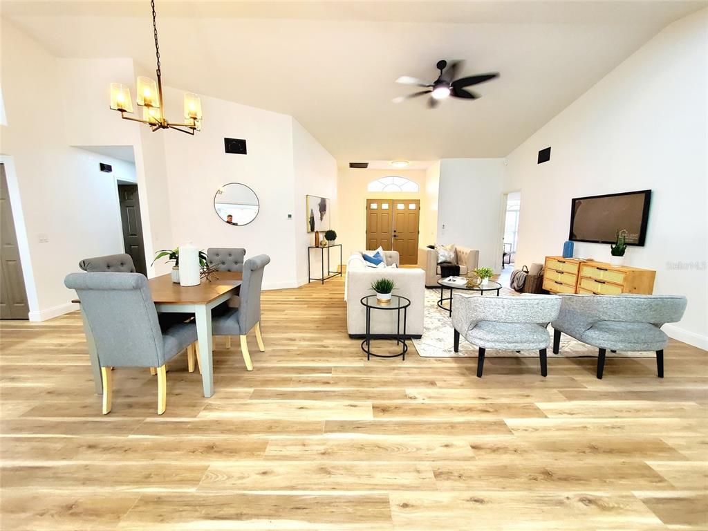 1517 Morning Rose Place Trinity, FL 34655 - Photo 9 of 50 a living room with furniture and a flat screen tv