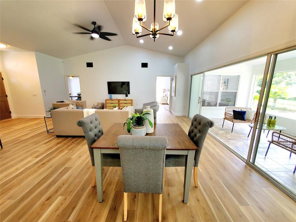 1517 Morning Rose Place Trinity, FL 34655 - Photo 10 of 50 a view of a dining room with furniture window and wooden floor