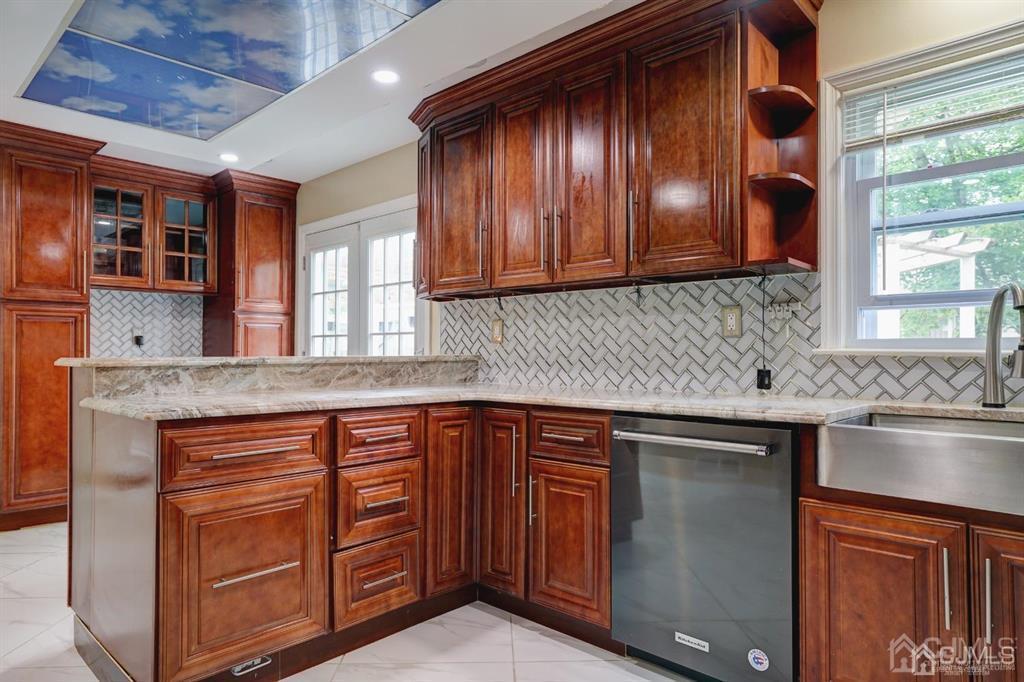 7 Calvert Avenue East Edison, NJ 08820 - Photo 12 of 47 a kitchen with stainless steel appliances granite countertop wooden cabinets a sink and dishwasher