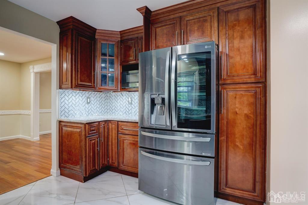 7 Calvert Avenue East Edison, NJ 08820 - Photo 15 of 47 a kitchen with stainless steel appliances granite countertop a refrigerator and a sink