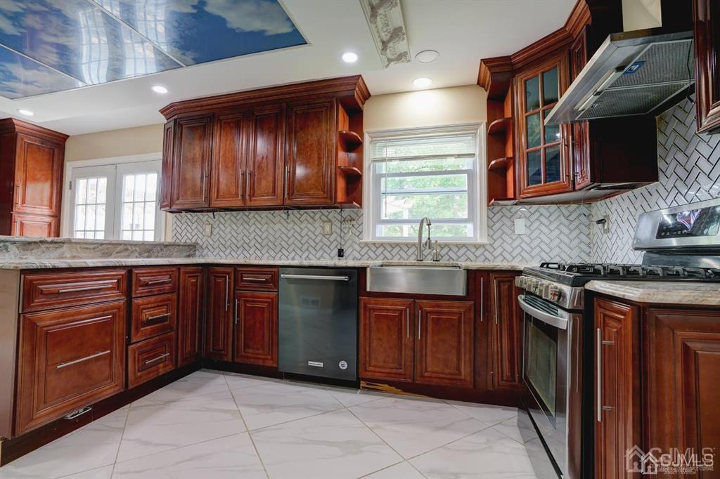 7 Calvert Avenue East Edison, NJ 08820 - Photo 21 of 47 a kitchen with stainless steel appliances granite countertop wooden cabinets a sink and dishwasher