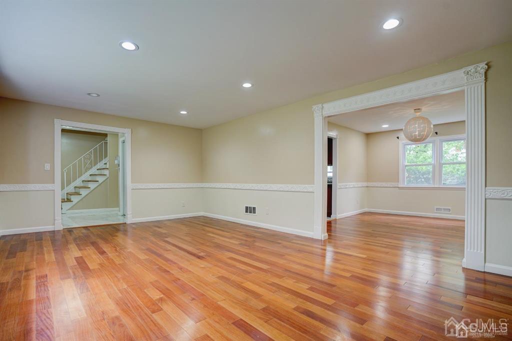 7 Calvert Avenue East Edison, NJ 08820 - Photo 23 of 47 a view of empty room with wooden floor and fan