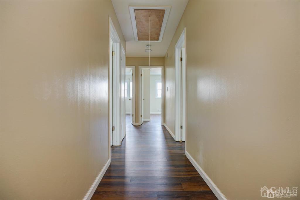 7 Calvert Avenue East Edison, NJ 08820 - Photo 32 of 47 a view of a hallway with wooden floor