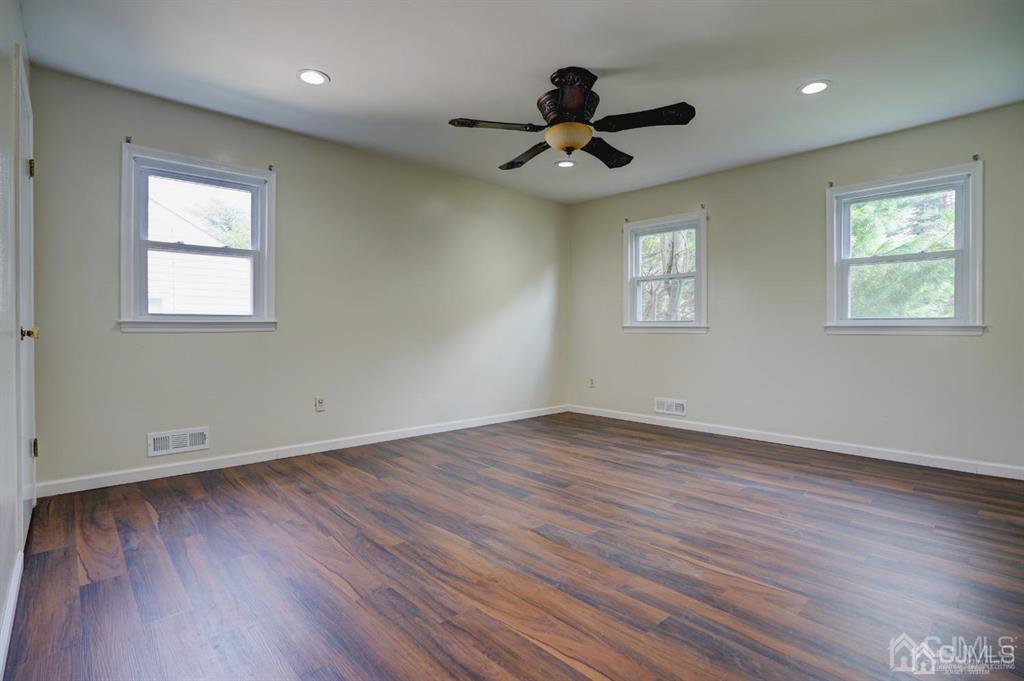 7 Calvert Avenue East Edison, NJ 08820 - Photo 36 of 47 a view of an empty room with wooden floor and a window