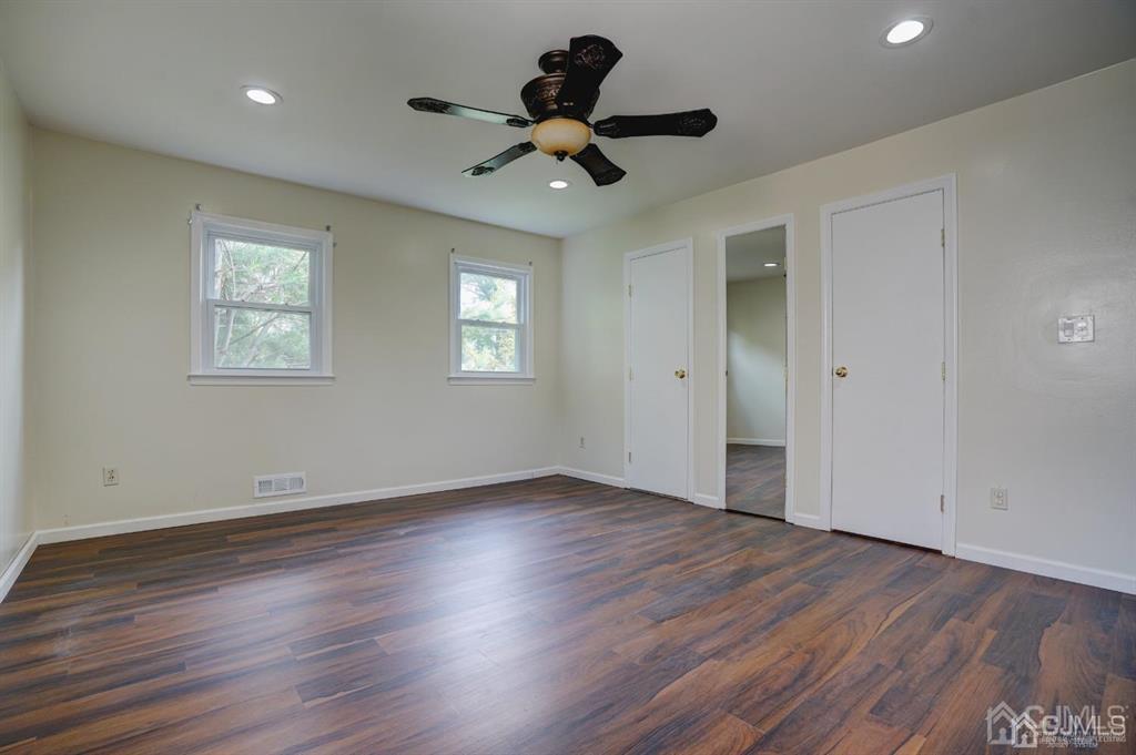 7 Calvert Avenue East Edison, NJ 08820 - Photo 37 of 47 a view of an empty room with wooden floor and a window